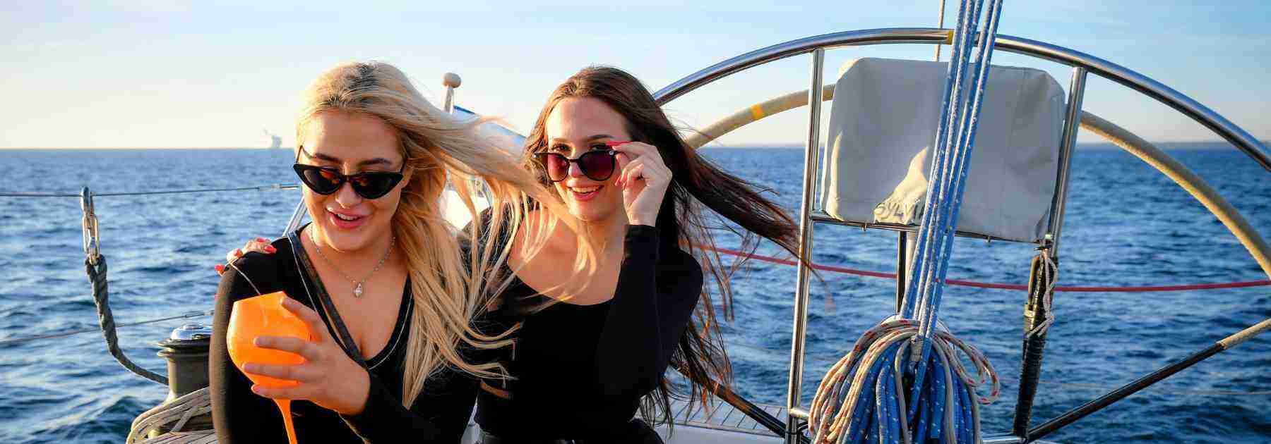 Women enjoying a boat ride on vacation