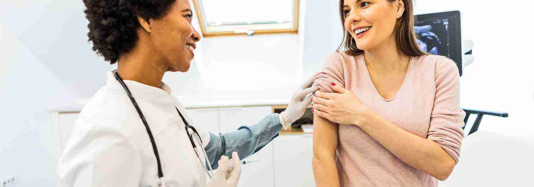 A woman happy to get a vaccine