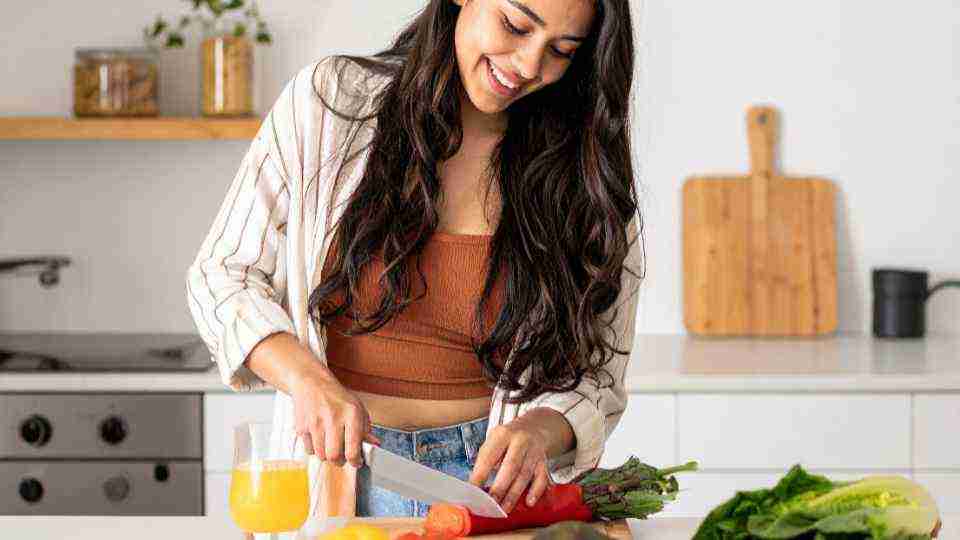 A woman cooking healthy food
