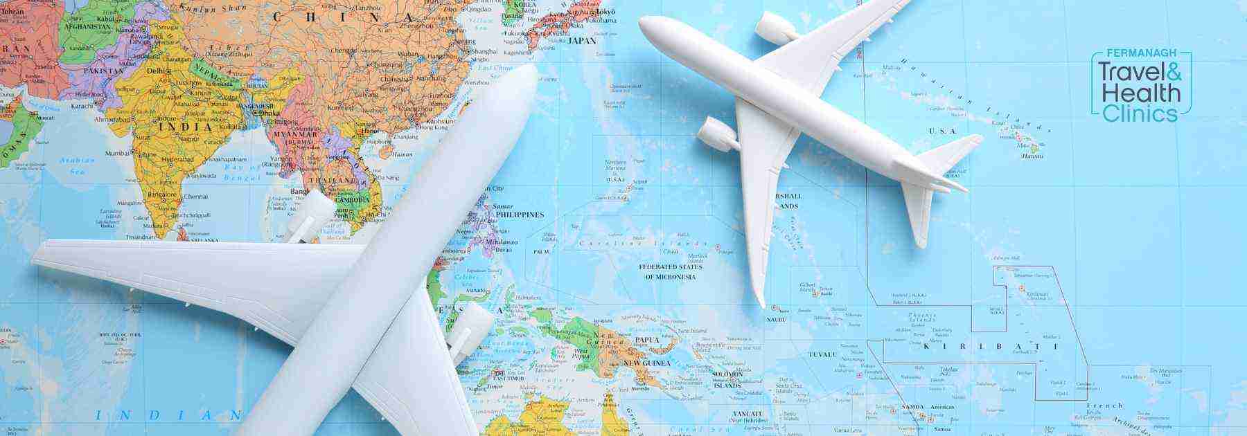 Model plane on a world map.
