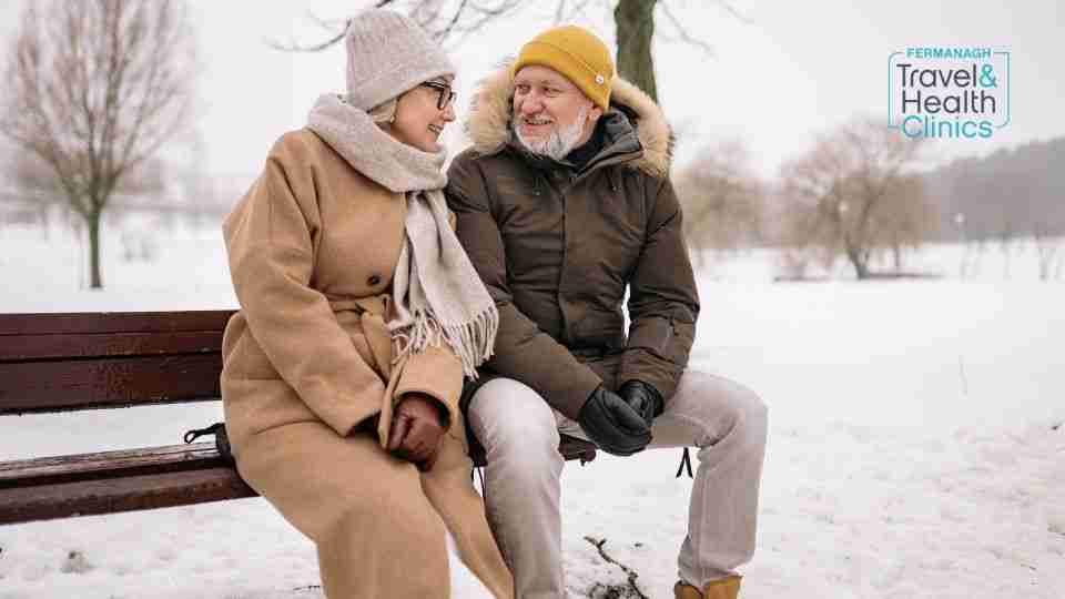 Elderly couple protected against winter illness enjoying the outdoors