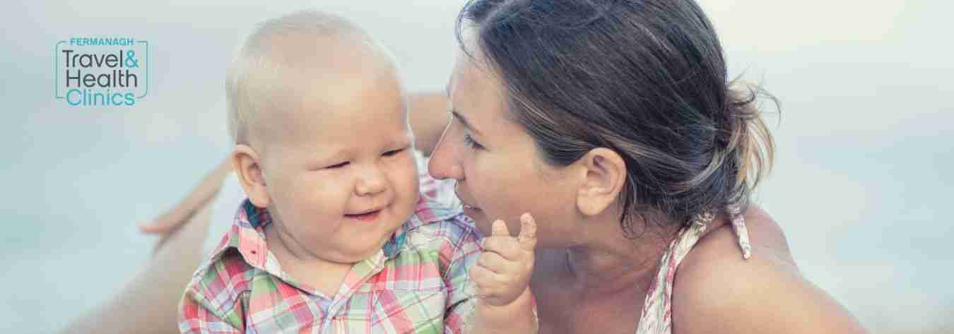 Mother and baby on a beach holiday